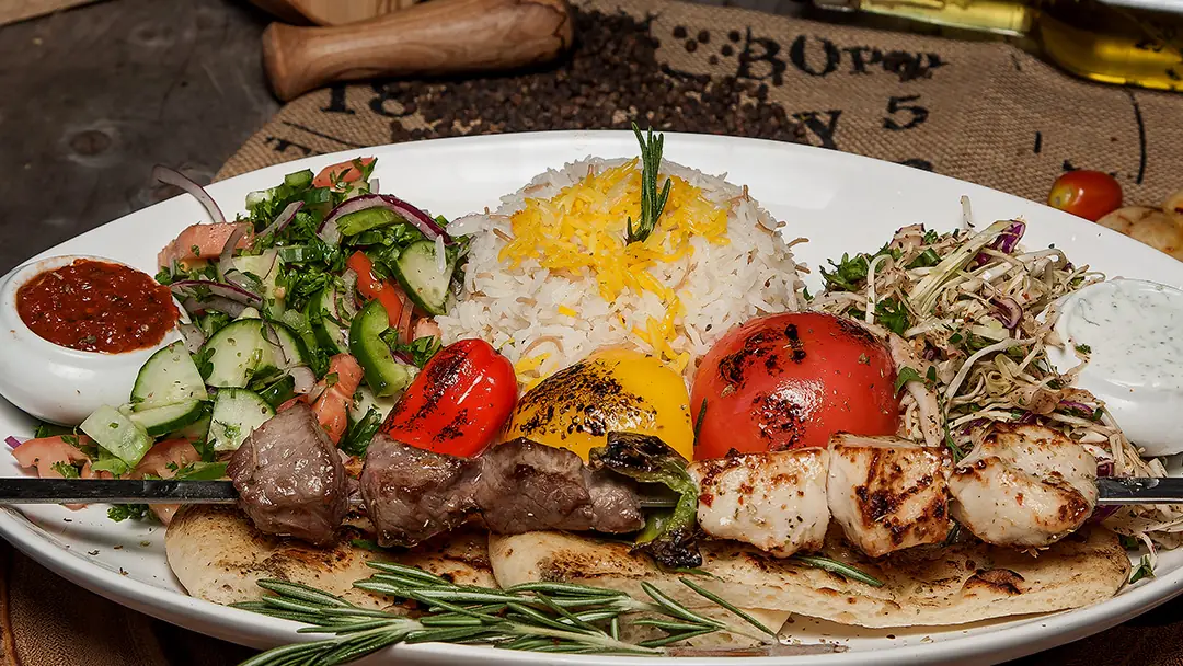 Shish kebab platter with rice and salad